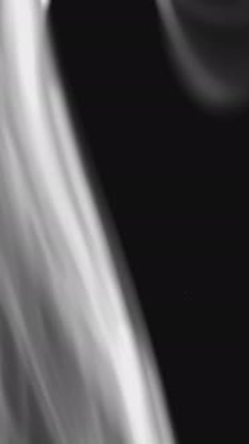 Abstract Smoke Streams Against Black Background