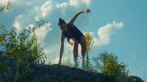 Young Female Athlete Navigates Rocky Descent During Tough Workout