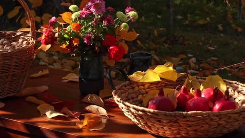 Autumn Harvest: Pomegranates, Flowers, and Walnuts