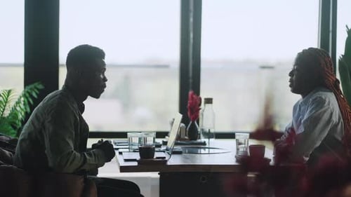 Business Professionals Meeting in Urban Restaurant