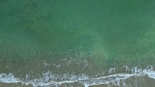 Junk floating by wave to shore, drone view. World ocean pollution problem concept.