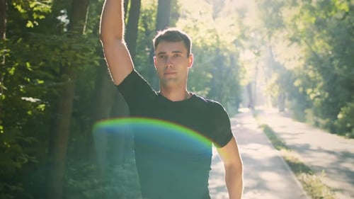 Jogging Young Man Enjoying a Sunny Day in the Park for Fitness and Health