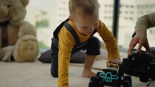 Children Playing with Toy Cars on Carpet Indoors