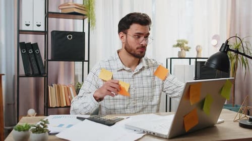 Indian Businessman Work on Laptop Sticky Notes with Many Tasks Inscription Overworked at Office