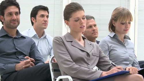 Business People Attending Corporate Meeting