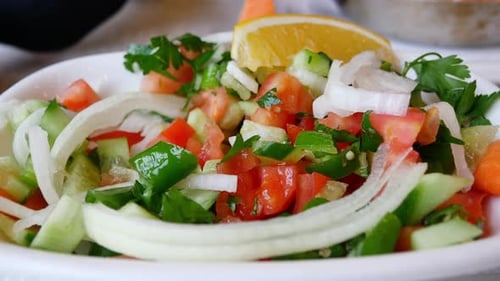 Fresh Vegetable Salad Preparation at a Lively Market