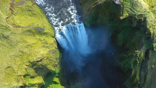 Slow motion aerial view of Skogafoss waterfall, Iceland