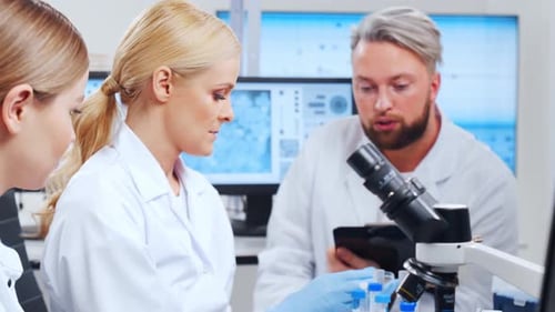 Medical Researchers Collaborating in a Modern Laboratory