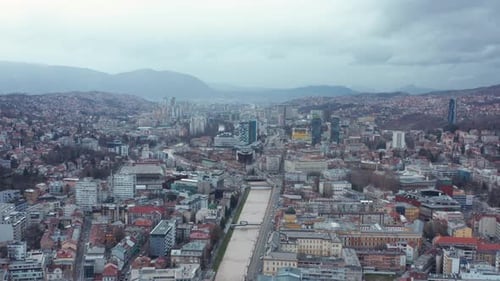Skyscrapers Of Sarajevo City With Dinaric Alps In The Background. aerial