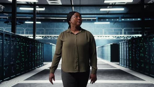 Portrait of Jolly Data Center Engineer Overseeing IT Equipment