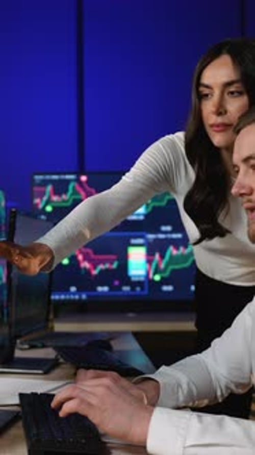 Financial Analysts Collaborating on Stock Market Trading Data