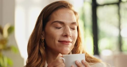 Woman Enjoys Coffee in a Bright Home