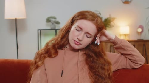 Woman Feeling Frustrated While Sitting on Couch