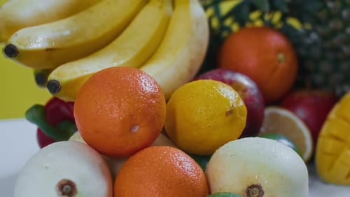 Juicy Fruits on Yellow Background