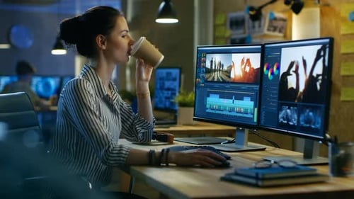 Female Video Editor Works with Footage and Sound on Her Personal Computer. Her Office is Modern and