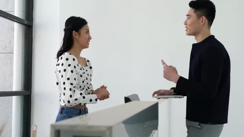 Professional Workplace Conversation at Modern Office Desk