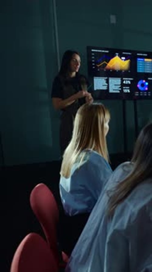 Businesswoman Presenting Analytical Charts on Digital Screen During Modern Office Meeting Explaining