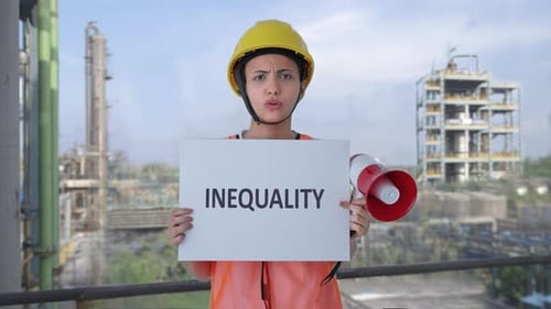 Angry Indian female construction worker protesting against INEQUALITY