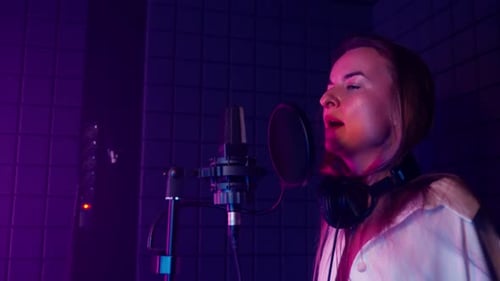 Professional Singer Recording Emotional Song in Music Studio