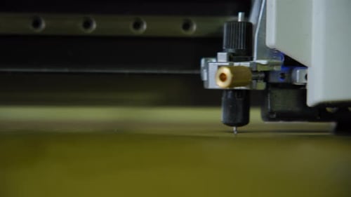 Commercial Plotter is Cutting a Paper Close Up Shot