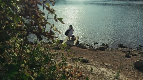 Photographer Takes Photo Near The Lake Water 1
