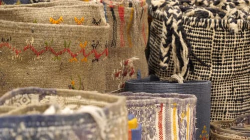 Different kinds of woven Persian carpets for sale on Marrakesh bazaar stall, Close up