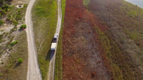 Aerial shot of truck with trailer on rural road