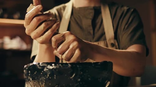 Man Potter Works with Clay on Master Class in Studio Working Process in Ceramic Workshop Potter