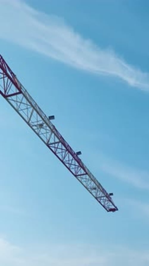 Vertical Video Construction Crane and Unfinished Building