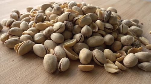 Food background. Roasted pistachio nuts seed with shell close up. Dieting concept