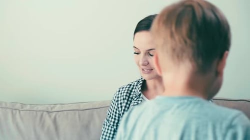 Affectionate Child Kisses and Hugs Smiling Woman