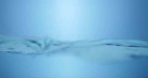 Water Surface Slow Motion Abstract Background. Bubbles rise to the surface. Fresh water waves with s
