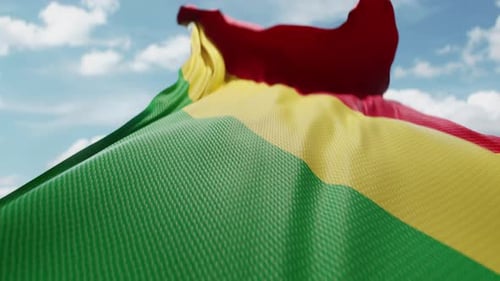 Pan-African Flag Waving Against Blue Sky
