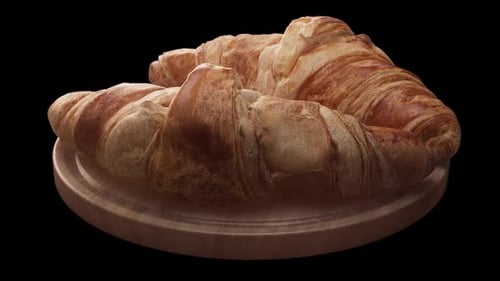 Frisch gebackene Croissants auf Holzbrett
