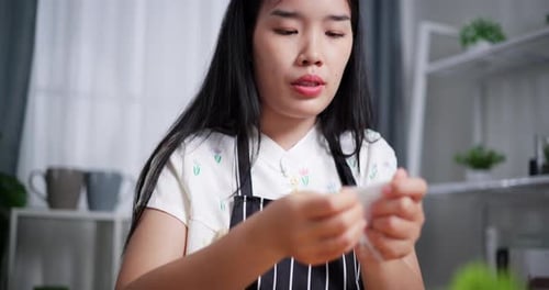Woman Prepping Vegetables in Kitchen