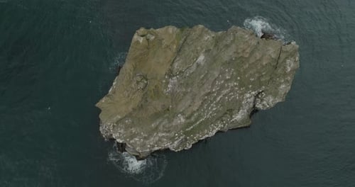 Aerial view of a rock in the sea, Iceland.