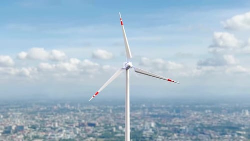 Modern Wind Turbine Against Cityscape