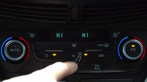 Finger turning off toggle switch of car air conditioner driver face and legs blow mode, two-phase