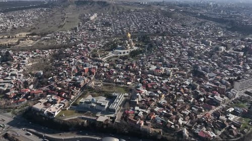 Aerial view of Holy Trinity Cathedral Sameba in Tbilisi Georgia. Sunrise drone footage.