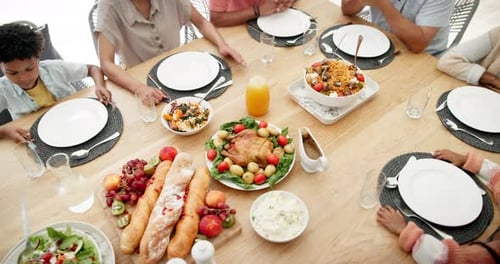 Overhead Shot of Family Dinner Table with Food