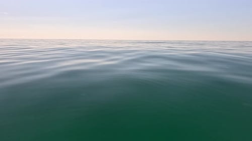 Sea Water Surface Low Angle View Over Clear Azure Sea Water Sun Glare Abstract Nautical Summer Ocean
