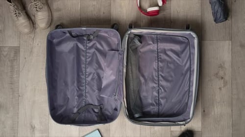 Stop Motion Animation Packing a Suitcase with Autumn Warm Clothes