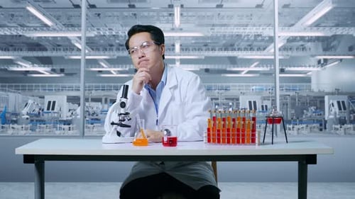 Scientist Examines Samples Using Microscope in Futuristic Lab