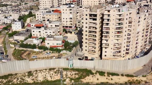 Security wall with Israeli idf watch tower Close to Anata Refugee Camp- Aerial