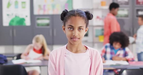 Smiling Girl in Classroom Close Up Portrait