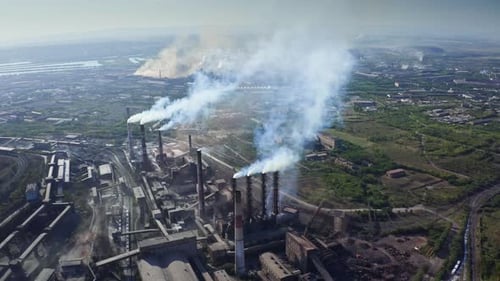 Aerial Panoramic View of Industrial Zone with Large Factory Pipes