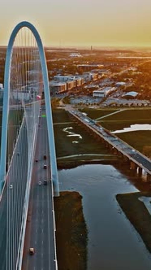 Aerial view of the Dallas skyline and bridge at sunset