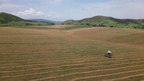 Aerial View Harvester Machine Drive In Crop Field