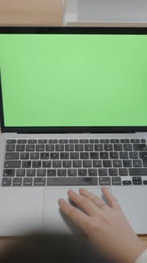 Hand of Woman Touching Touchpad of a Laptop with Chromakey Green Screen in Coworking Office Pullback