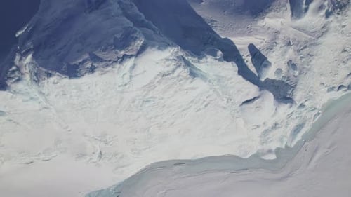 Top View Of Greenland's Icebergs And Their Long Shadows